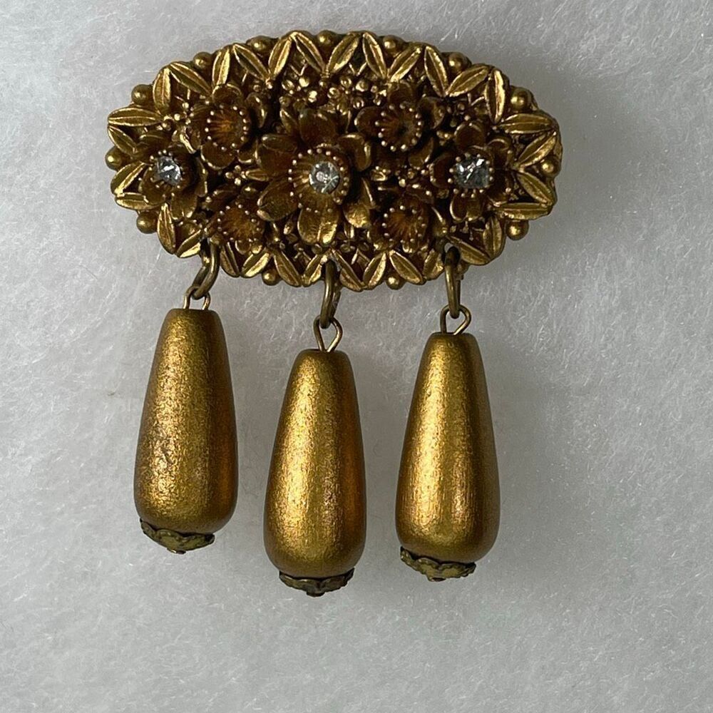 Vintage celluloid float dangle gold tone brooch